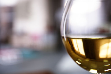 Glass of wine on blurred background