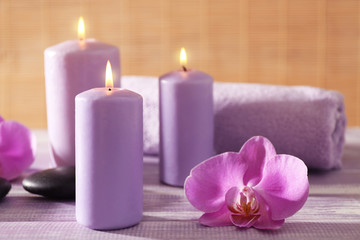 Spa set with flowers on wooden table