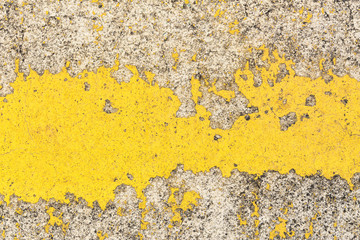 Old yellow  paint marks on the cement floor