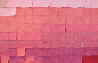 Square piece of fabric with shade of pink