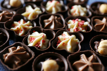 Tasty chocolate candies background, close up