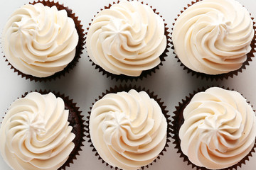 Tasty cupcakes on white background, close up