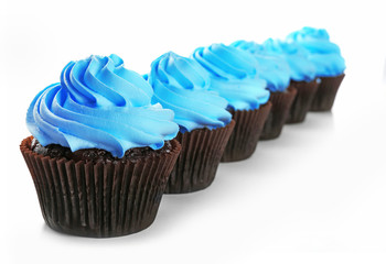 Delicious cupcakes isolated on white background