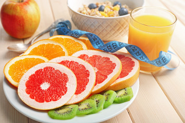 Tasty oatmeal and fruits on wooden background. Healthy eating concept.