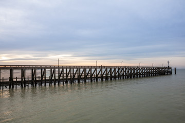 Fototapeta na wymiar the pier whit light pole at the sea