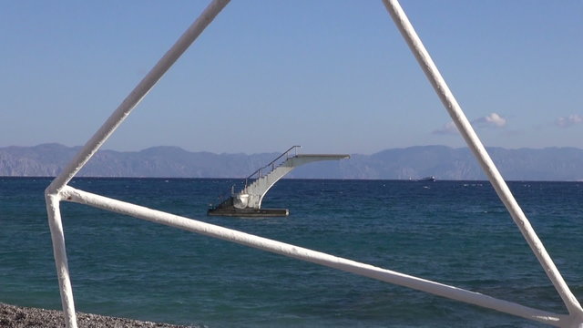 Sunlit springboard in the sea in Rhodes island, Greece off season
