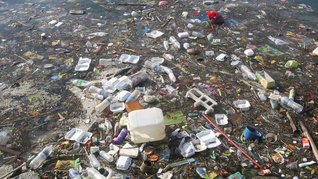 Plastic bottles and other trash floating in ocean