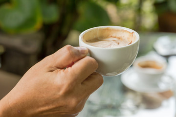 cup of coffee in the hands