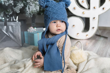 Happy little boy with fur headphones
