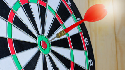 Dart stab target classic board  on wooden background