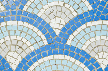 Blue and white square shaped tiles in circular pattern