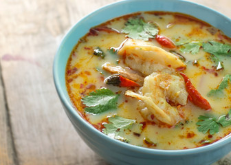 tom yum kung on rustic wood