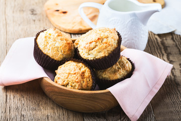 Homemade muffins in wooden bowl