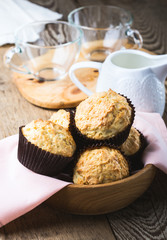 Homemade muffins in wooden bowl