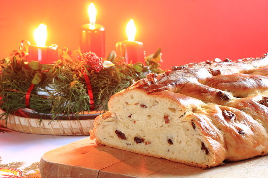 Traditional Czech Christmas cake with candles in the background