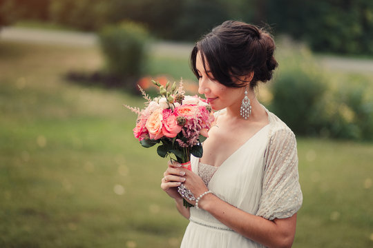 Bride holds boho wedding bouquet