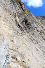 Steel cable from a via ferrata in a mountain rock face, Hohe Tauern Alps, Austria