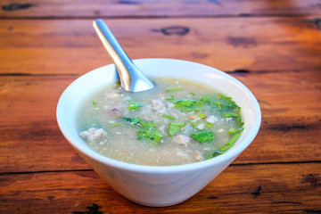 Thai style breakfast soft boiled rice mixed with ground pork