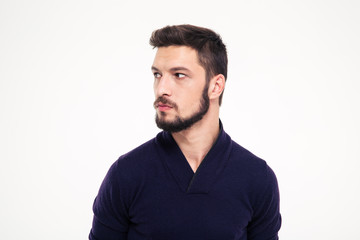 Potrait of attractive thoughtful young man with beard in sweetshirt