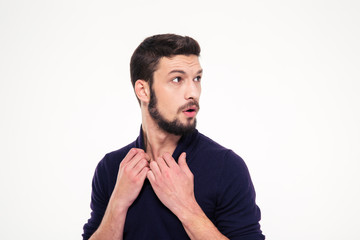 Fototapeta premium Scared dazed handsome young man with beard in sweetshirt