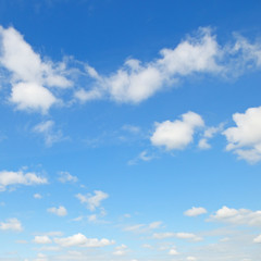 Naklejka na ściany i meble white cumulus clouds against the blue sky