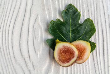 sliced figs and fresh leaf-black genoa gene