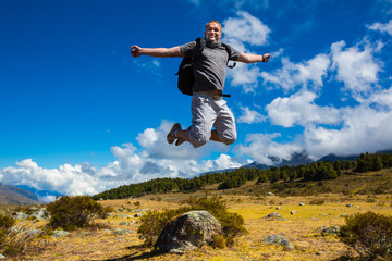 Man jumping on the background of the mountains of the Andes