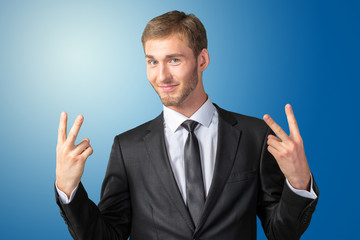 Young Businessman showing victory sign
