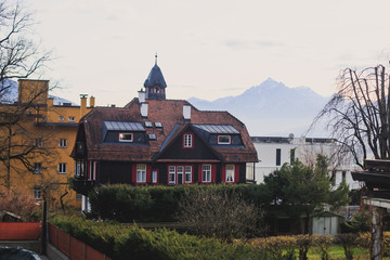 Beautiful super wide-angle aerial view of Innsbruck, Austria with skyline, Alps mountains and scenery beyond the city, and Inn river 