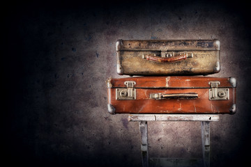 Vintage suitcases on chair