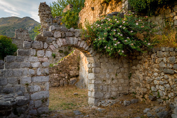 Ancient fortress arch way and ruined walls