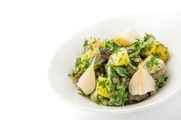 Potatoes and mushrooms salad on the white background horizontal