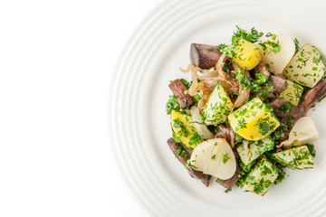 Potatoes and mushrooms salad on the white background top view