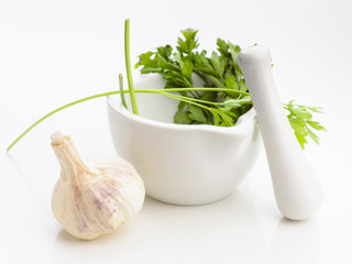 kitchen mortar with garlic and parsley