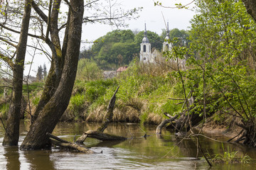 Church in the Baltow seen from the river Kamienna, Poland © Marcin Michalczyk