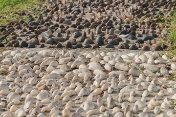 Mini stone dark and white half and half bury on the sand for dec