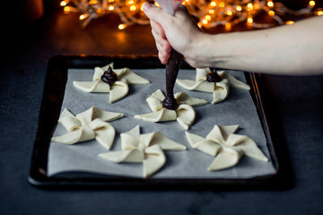Joulutorttu, traditional finnish christmas pastry. Dark photo. selective focus