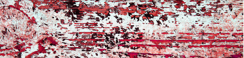 Flaking blood red paint on white wood, grunge background texture.