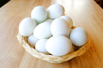 An eggs basket laying on the table.
