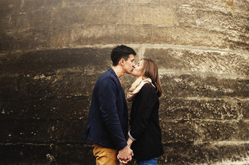 cute stylish gorgeous tender couple in love  kissing on the back