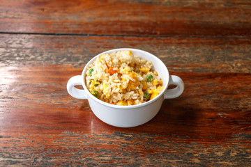 Fried rice mixed vegetables in a cup of children