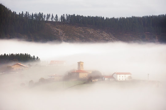 village in Aramaio valley surrounding by fog