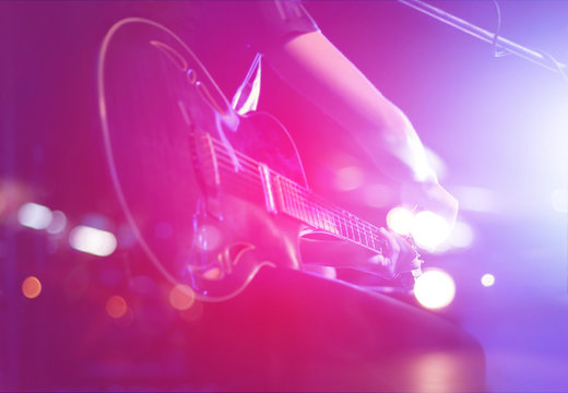 Guitarist on stage for background, soft and blur concept