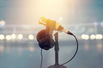 Close up microphone and headphone for announcer in boxing stadium