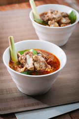 Hot and spicy soup with pork ribs,shallow Depth of Field,Focus on  pork ribs.