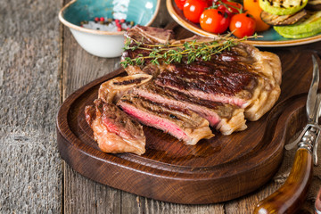 Beef steaks with grilled vegetables and seasoning