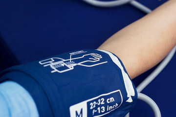 Close up checking woman patient arterial blood pressure, Health