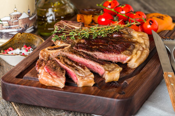Beef steaks with grilled vegetables and seasoning