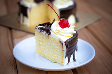 Birthday cake, vanilla Chocolate Cherry was divided pieces on a