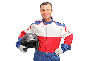 Young car racer holding a gray helmet